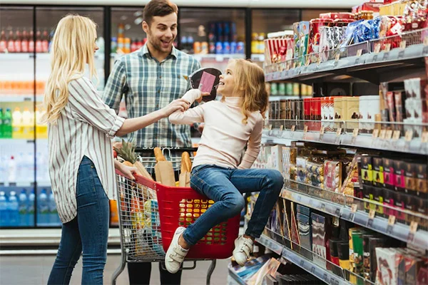 happy family in supermarket