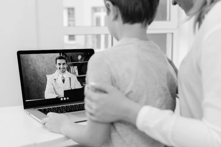 mom and boy in telemedicine appointment