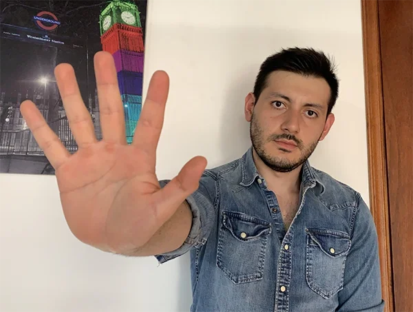 man saying hello in sign language